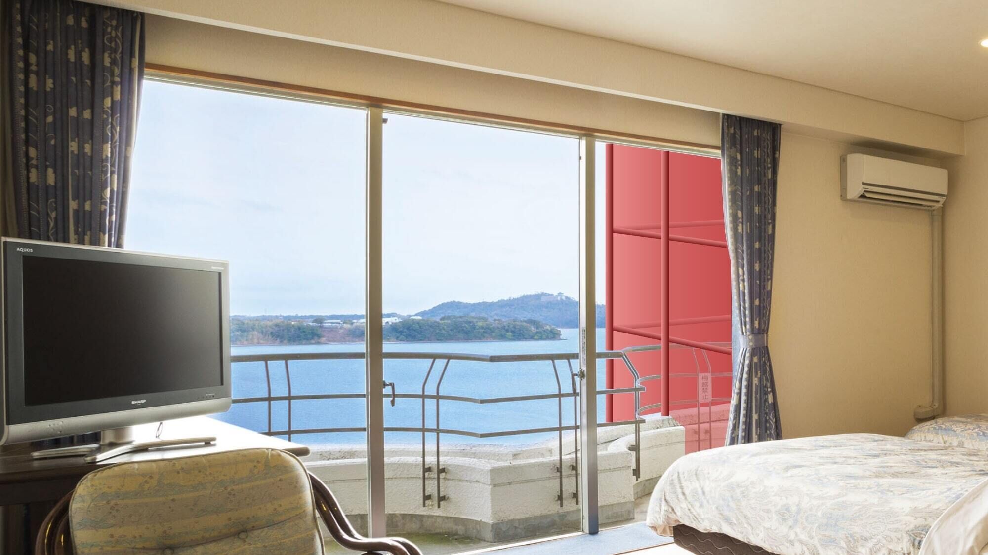 A hotel room with a television, a bed, a balcony with a view of a body of water and hills, and an air conditioning unit.