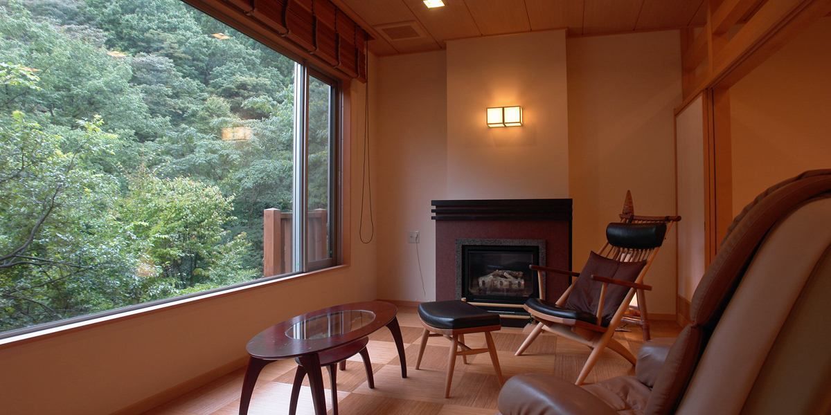 japanese style room with flooring living room, non smoking | living area | flat-screen tv