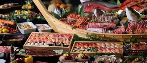 A variety of seafood and sushi dishes displayed on wooden trays and tables.
