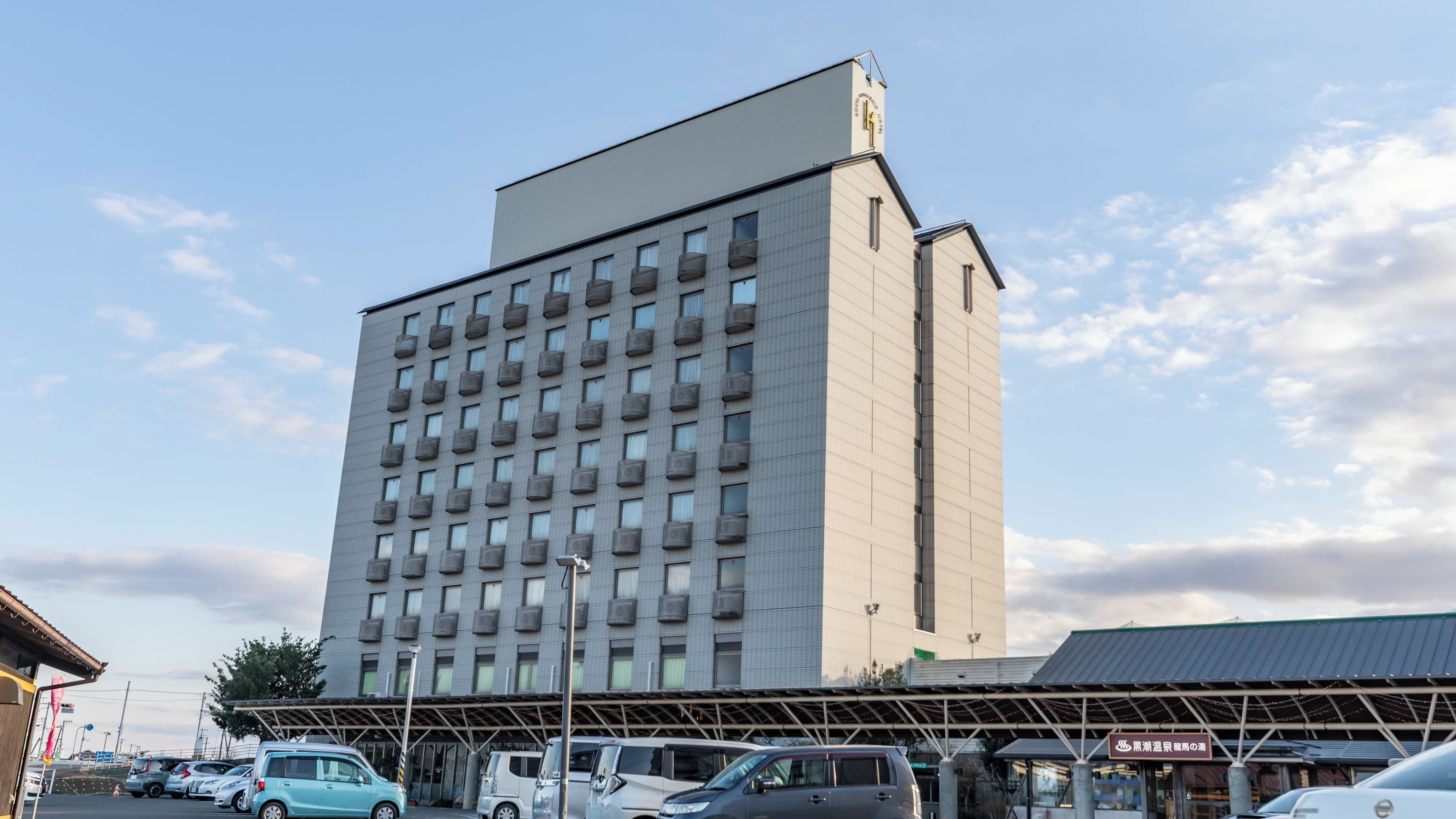 A multi-story hotel with a flat facade and numerous windows.