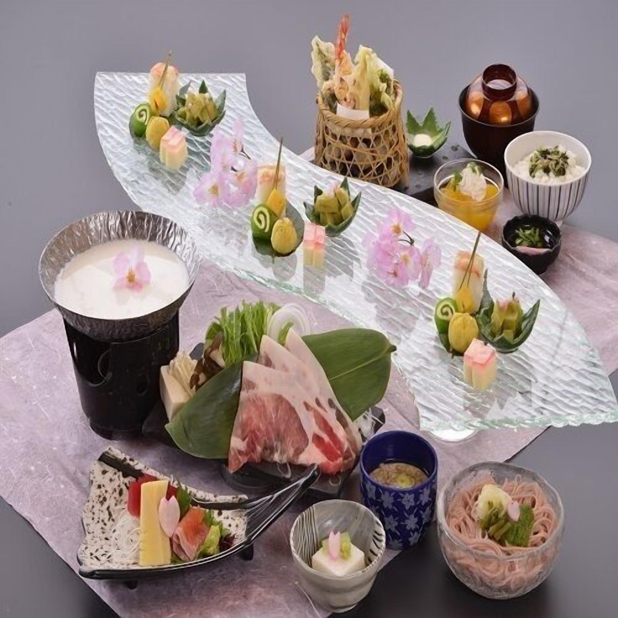 A variety of dishes and food items arranged on a table.
