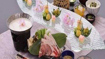 A variety of dishes and food items arranged on a table.