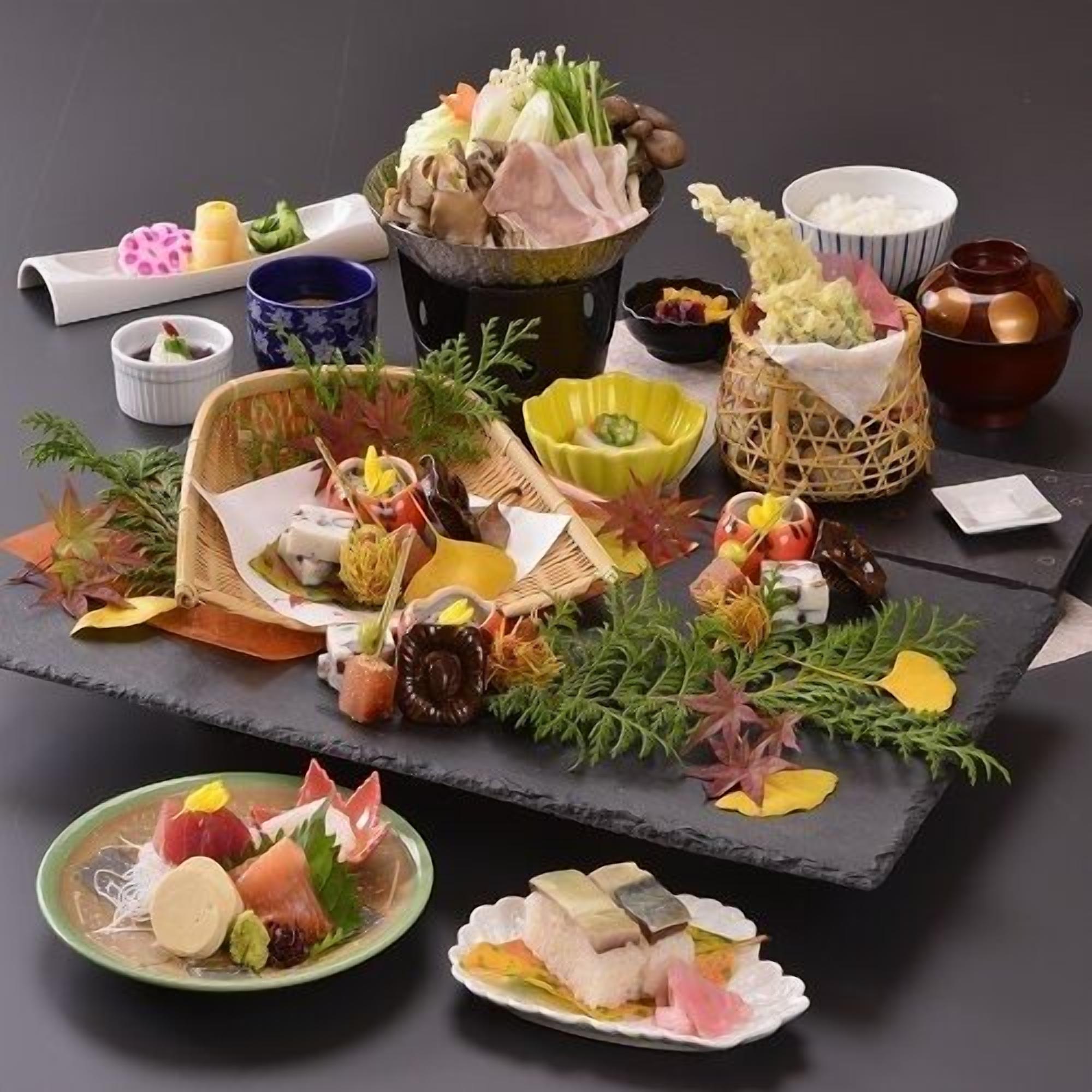 A variety of food items and dishes arranged on a table.