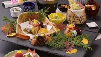 A variety of food items and dishes arranged on a table.