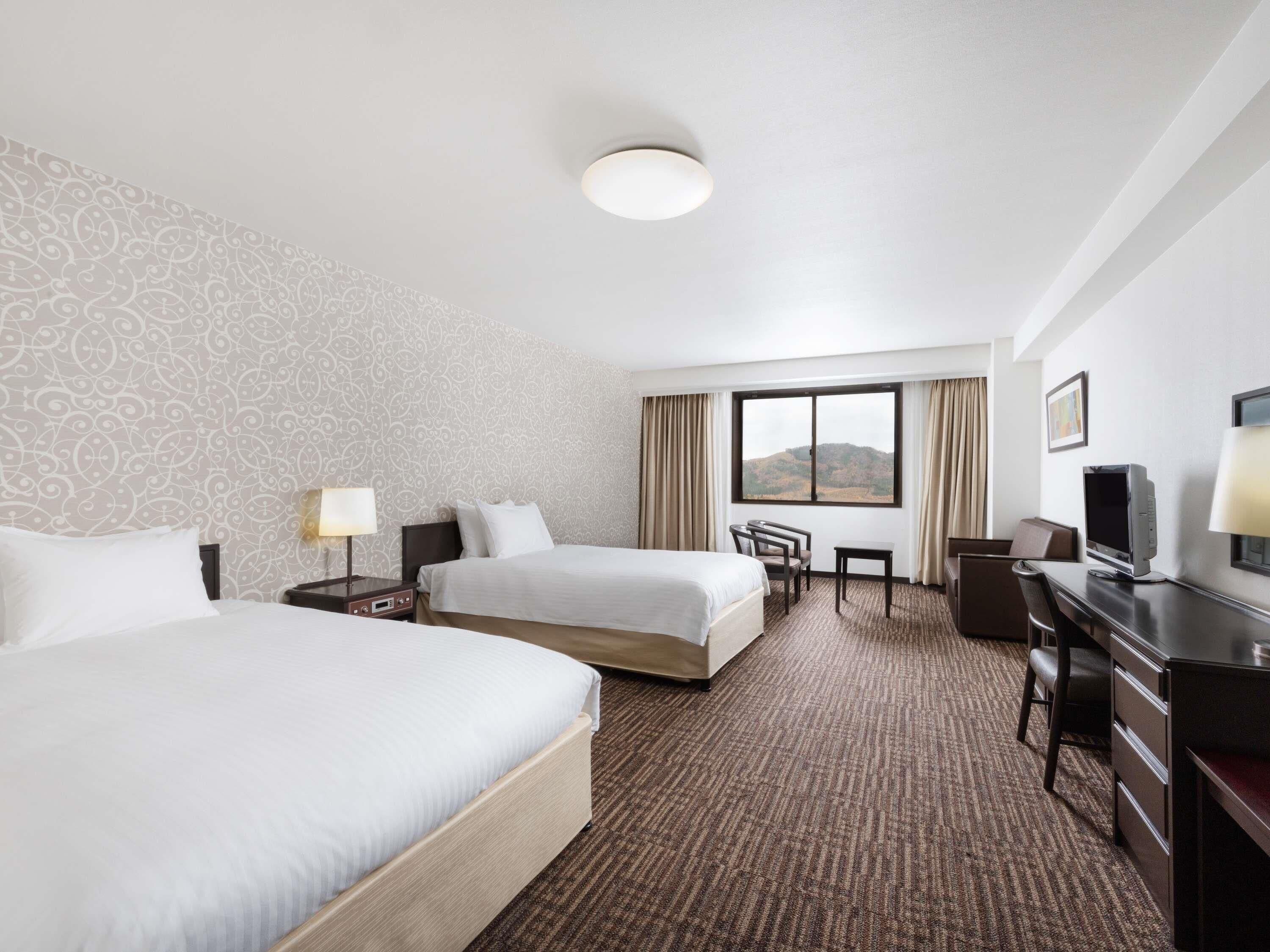 Privilege Room with 2 single beds and 1 extra bed