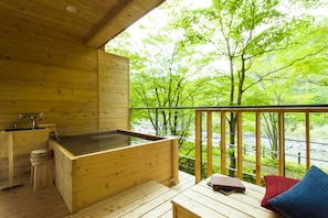 Outdoor bath with mountain stream side tatami room | Bathroom