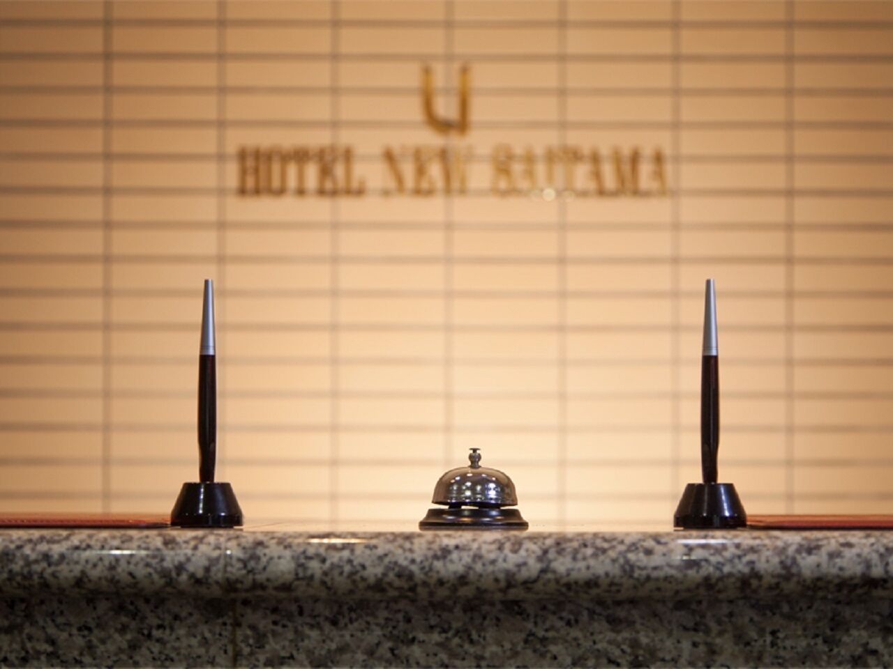 A reception area with a wooden counter and a reception desk.