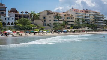 On the beach, sun loungers, beach towels