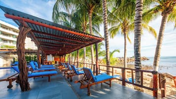 On the beach, sun loungers, beach towels