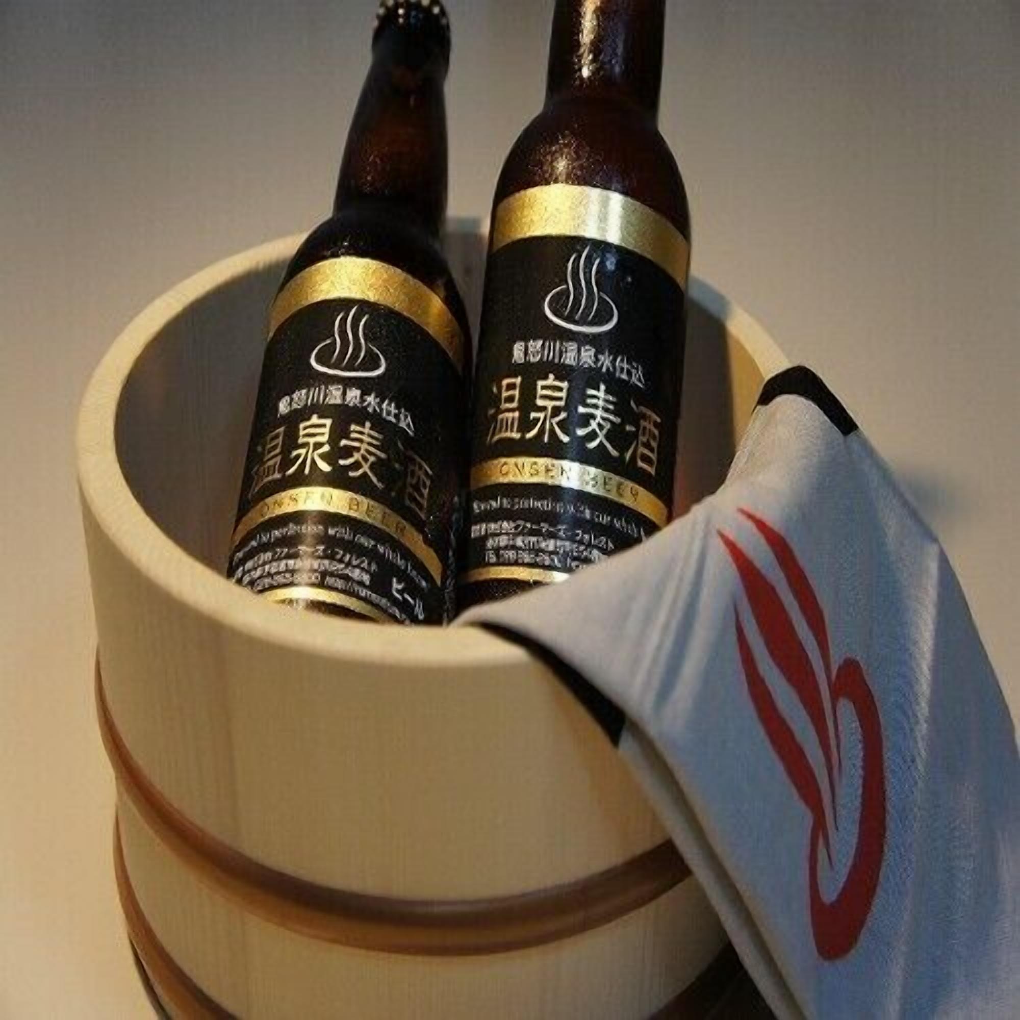 Two bottles of beer in a wooden bowl with a flag.