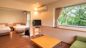 A hotel room with two beds, a TV, a small table, and a sofa. - Hotel Forest Hills Nasu With Dogs (Nasu)