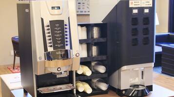 A coffee machine with multiple drink options and a coffee bean dispenser.