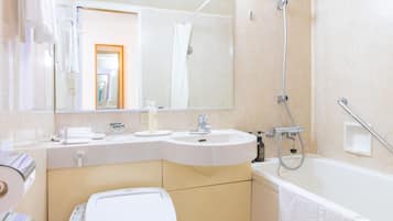 Combined shower/tub, free toiletries, hair dryer, slippers