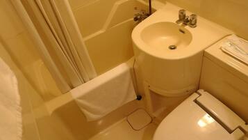 Combined shower/tub, free toiletries, hair dryer, slippers