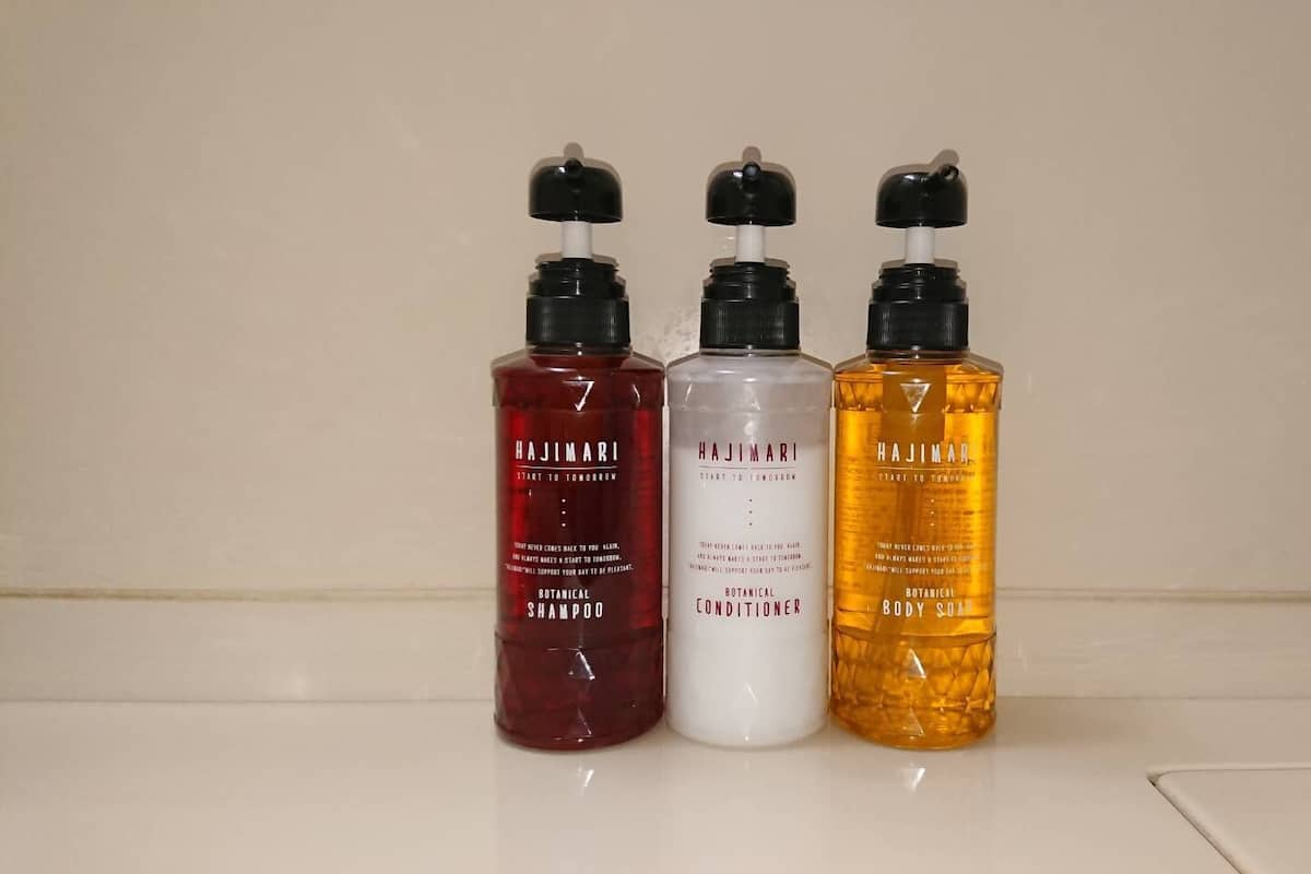 Three bottles of Hajimari products on a white surface.