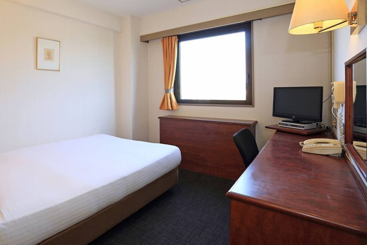 Basic Double Room | Desk, blackout drapes, iron/ironing board, free WiFi
