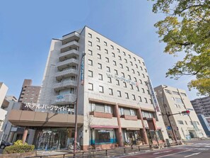 A multi-story hotel with a modern facade, multiple balconies, and a ground-level entrance. - Business Hotel Park Side Takamatsu (Takamatsu)