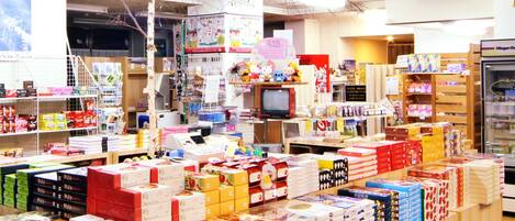 A retail store with various products on shelves and counters.
