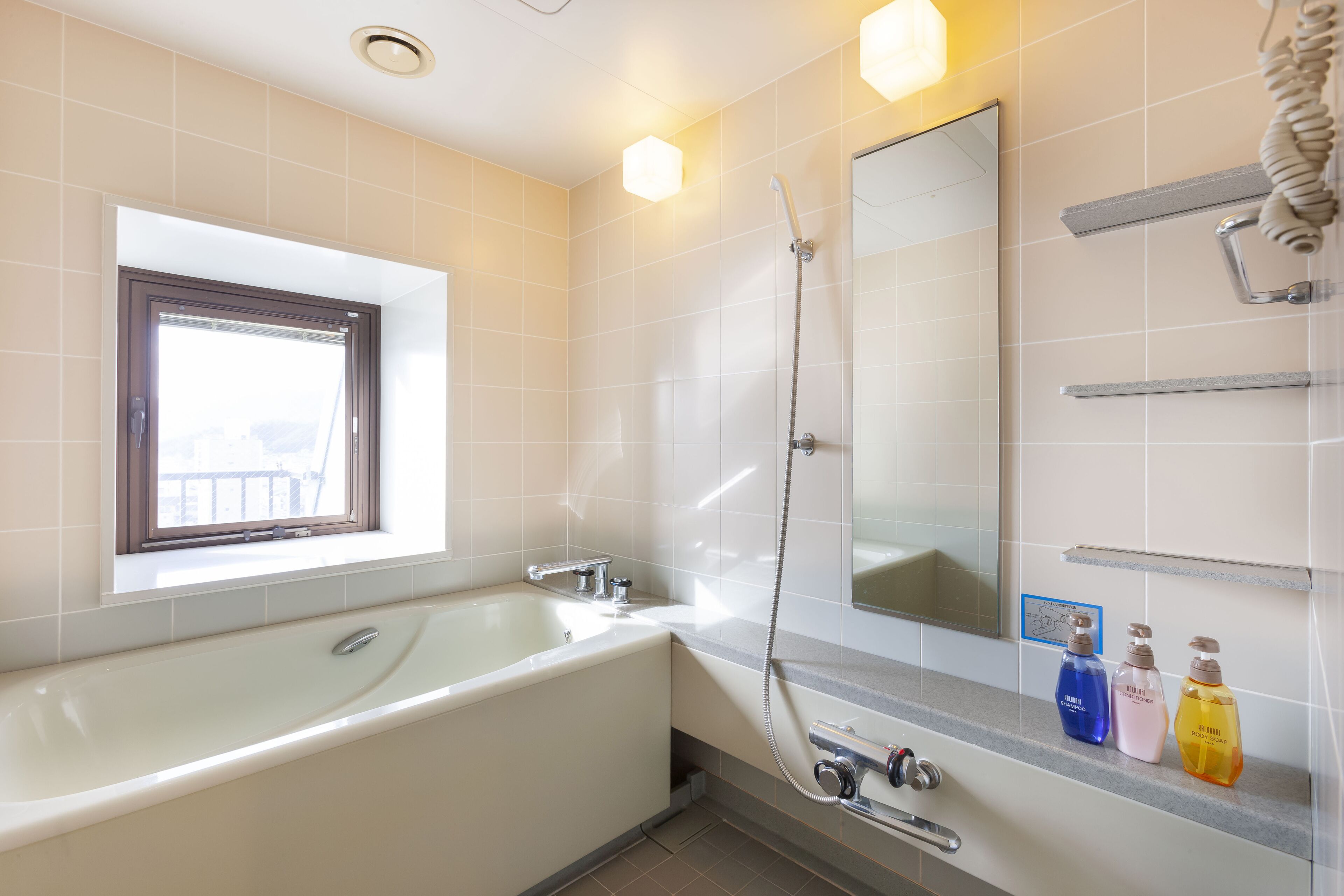 premium king suite, non smoking | bathroom | combined shower/bathtub, free toiletries, hair dryer, slippers