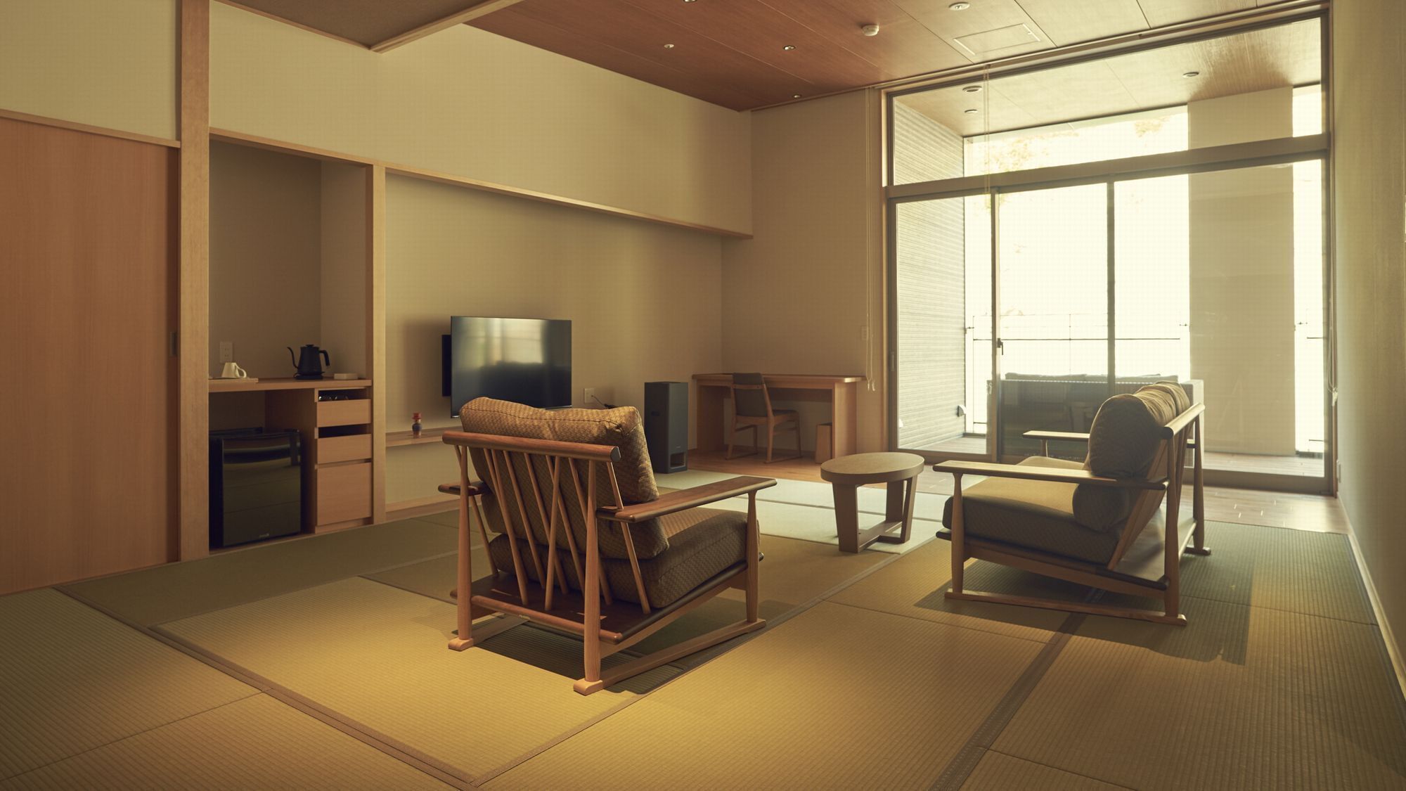 A modern living room with tatami flooring, a television, a sofa, and a dining area.