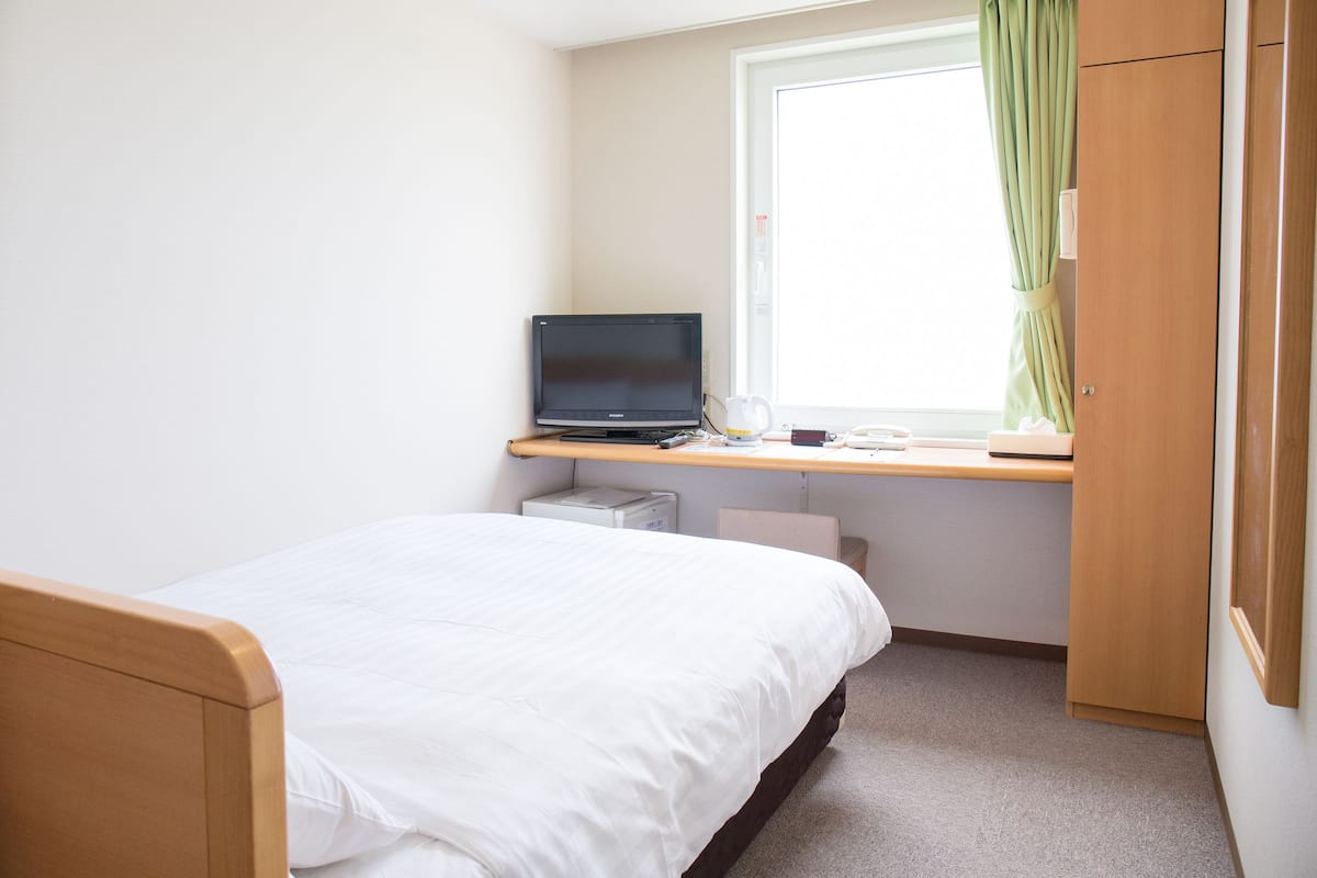Desk, blackout curtains, free WiFi, bed sheets