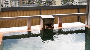 A traditional Japanese onsen with a wooden deck and a view of a mountainous landscape. - Gero Onsen Okudaya Happoen (Gero)
