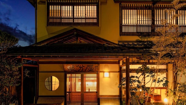 A traditional Japanese house with a wooden gate, tatami mat flooring, and a lantern-lit entrance. - Oiwakeya Ryokan (Matsumoto)