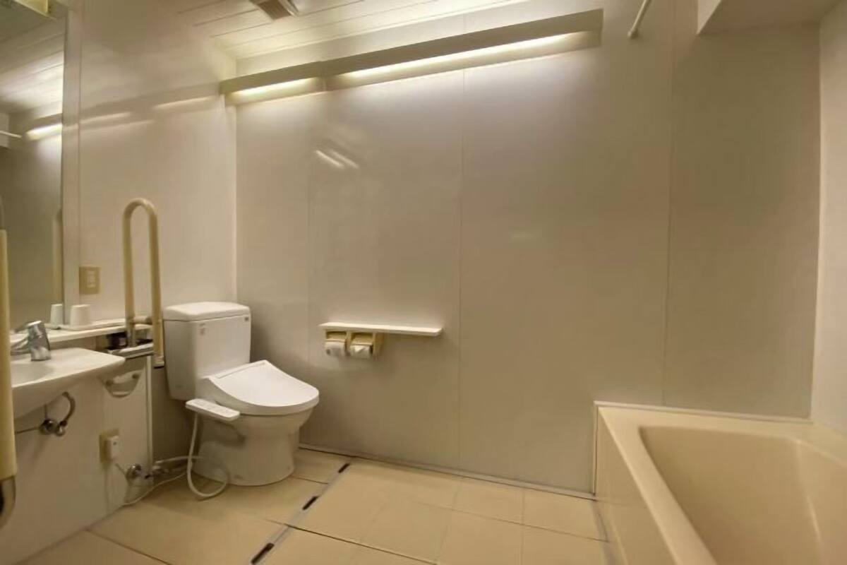 Bathroom | Combined shower/bathtub, hair dryer, slippers, electronic bidet