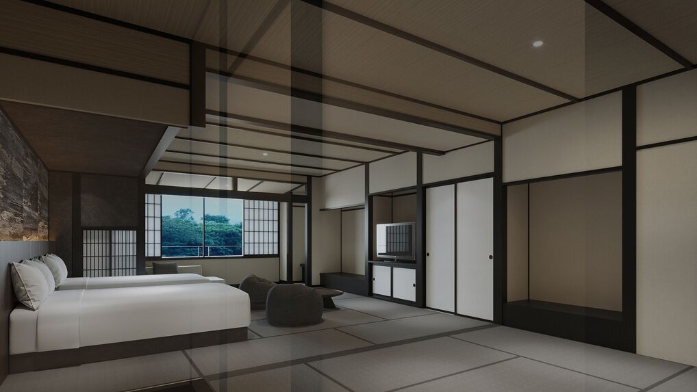 Une chambre moderne avec un lit, un coin salon et une grande fenêtre.
