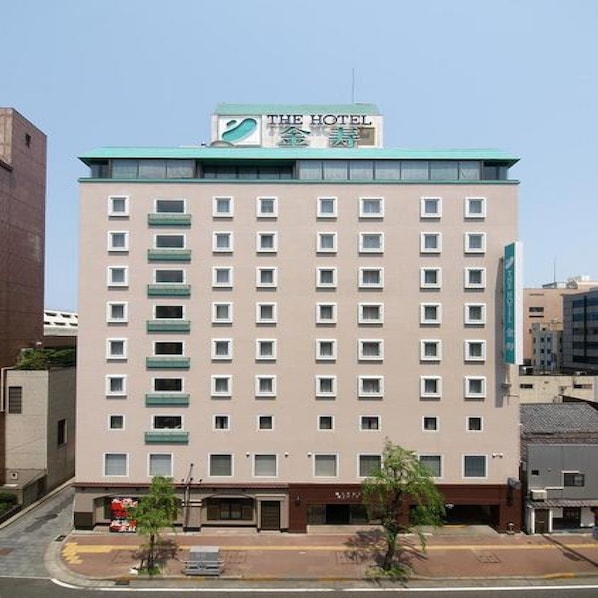 A multi-story hotel with a sign reading "THE HOTEL".