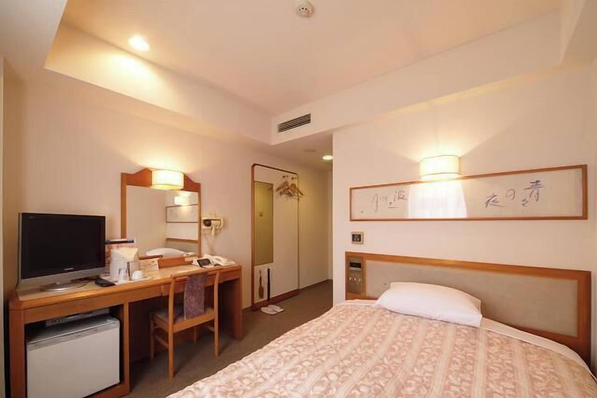 Desk, laptop workspace, blackout curtains, free WiFi