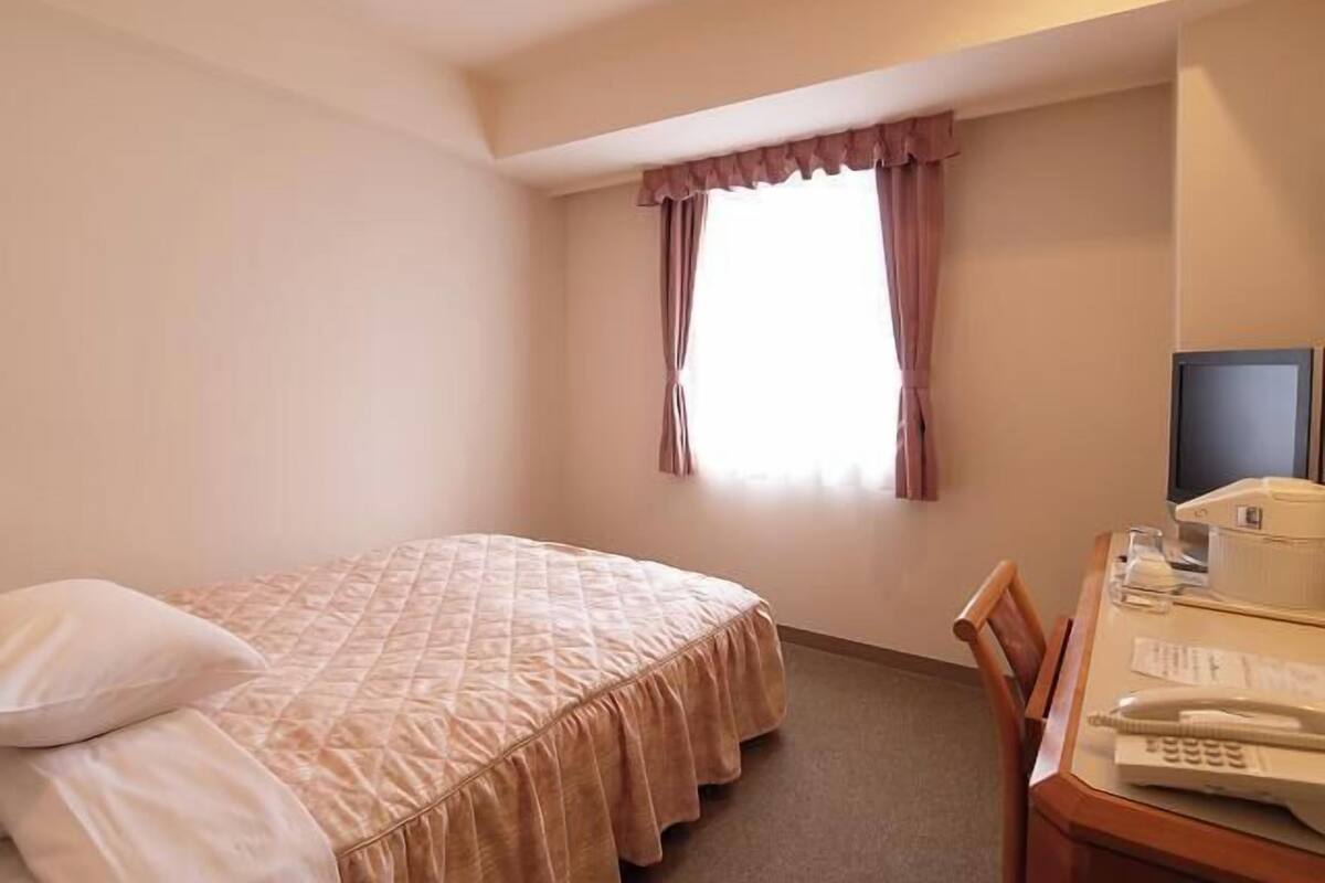 Desk, laptop workspace, blackout curtains, free WiFi
