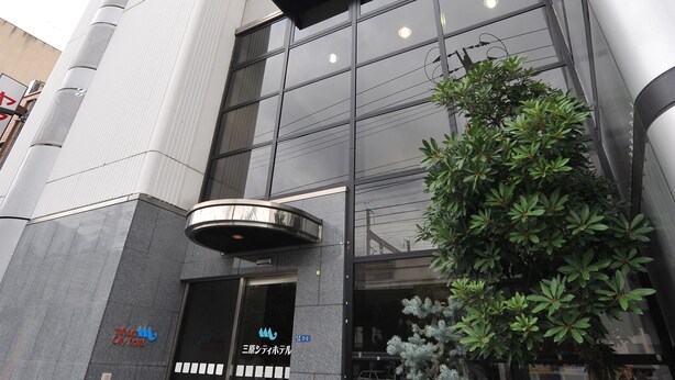 A modern hotel building with a glass facade, a prominent sign reading "Hotel", and a sign indicating it is a "3-star hotel". - Mihara City Hotel (Mihara)