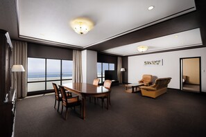 Deluxe Suite, Multiple Beds, Sea View | Living area | LCD TV