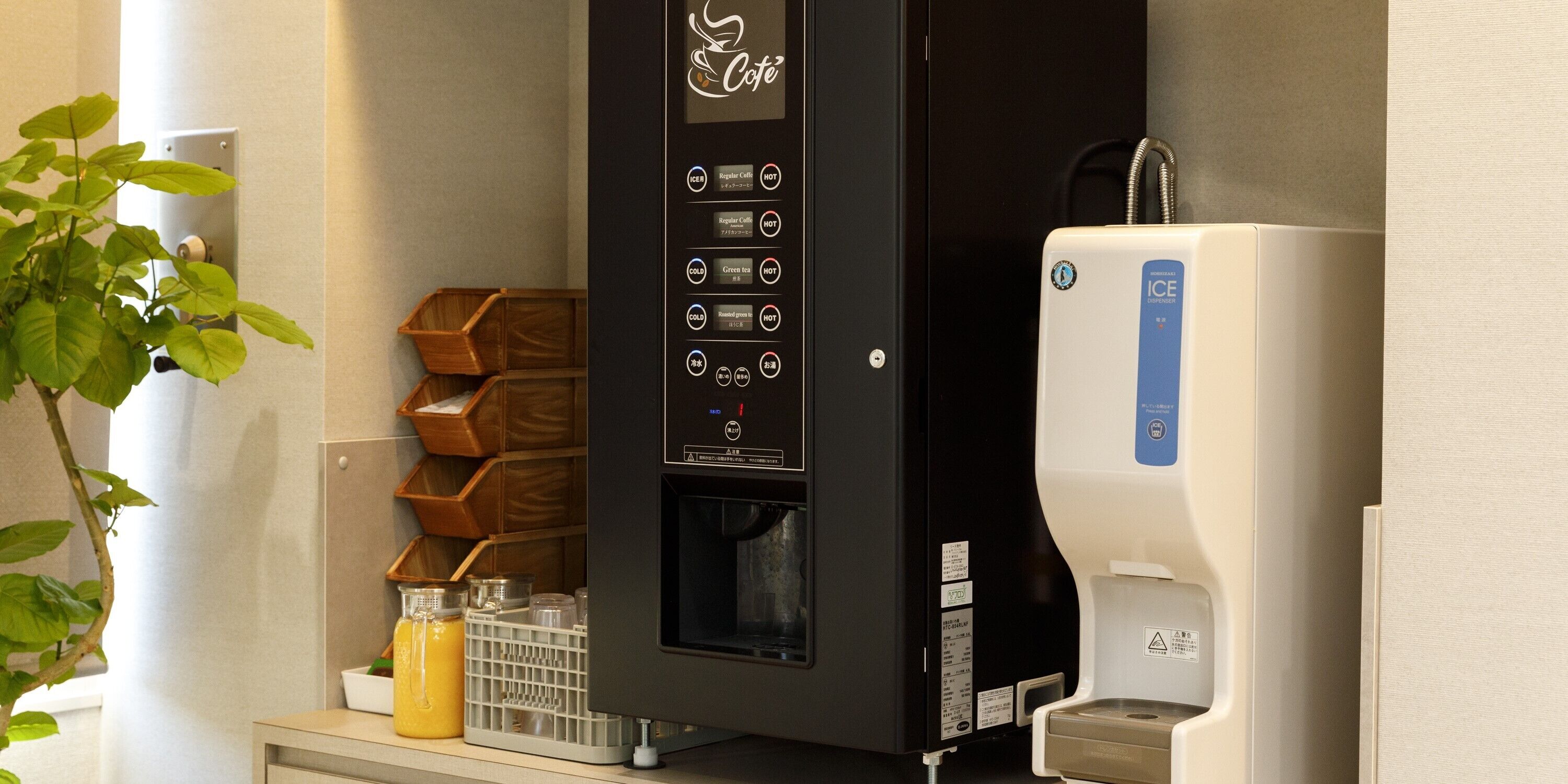 A coffee machine with multiple brewing options and a water dispenser.