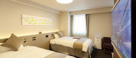 A hotel room with two beds, a flat-screen TV, a window with curtains, and a wall-mounted artwork.
