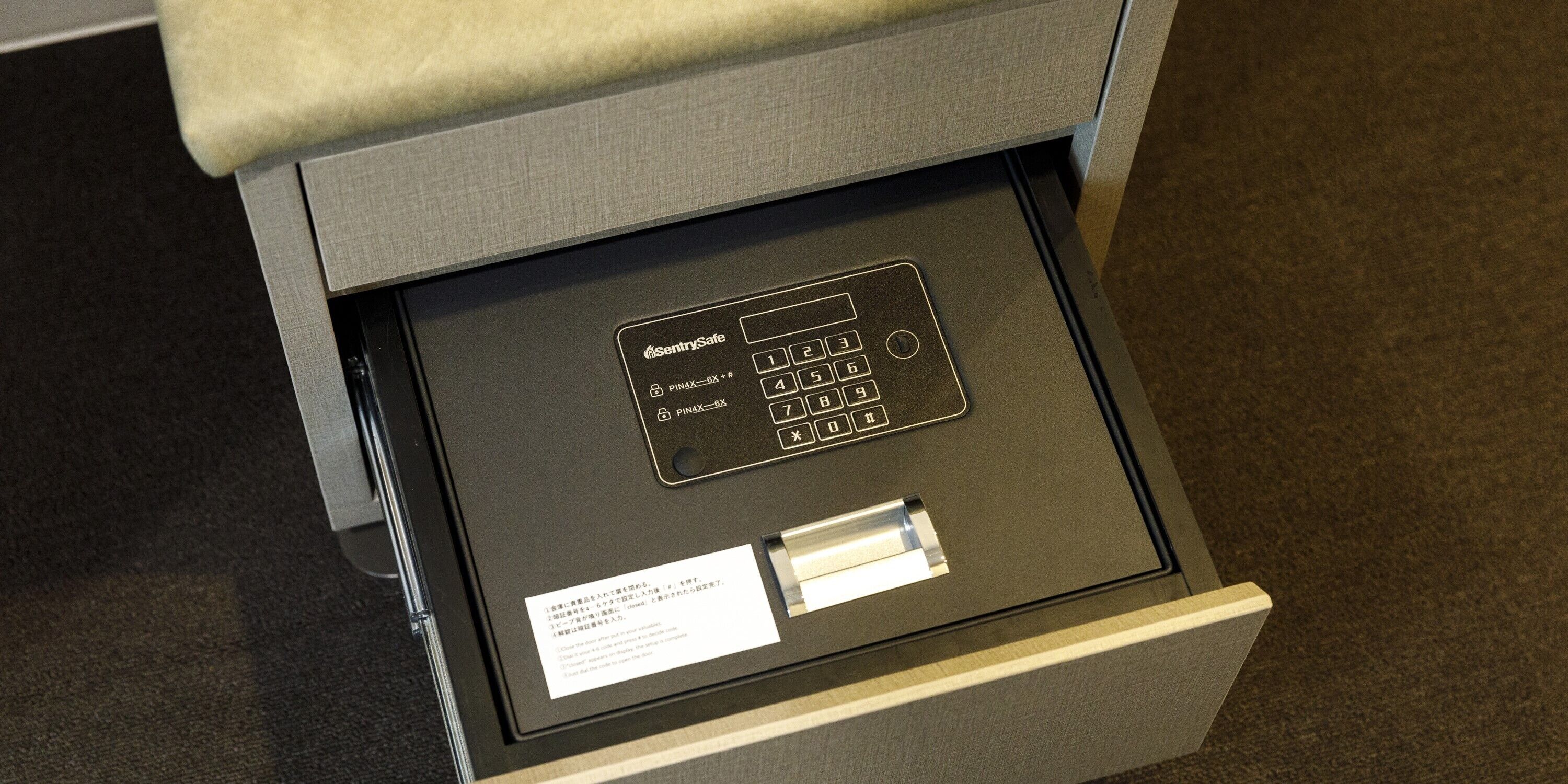 A close-up of a security keypad with PIN options and a card slot.
