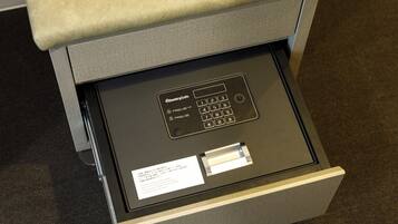A close-up of a security keypad with PIN options and a card slot.