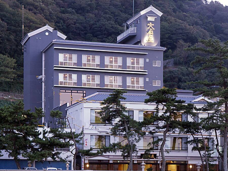 A multi-story hotel with a prominent sign on the top.