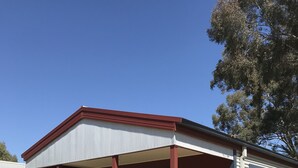 A single-story mobile home with a porch, a window, and a door. - Bundalong Holiday Resort (Bundalong)