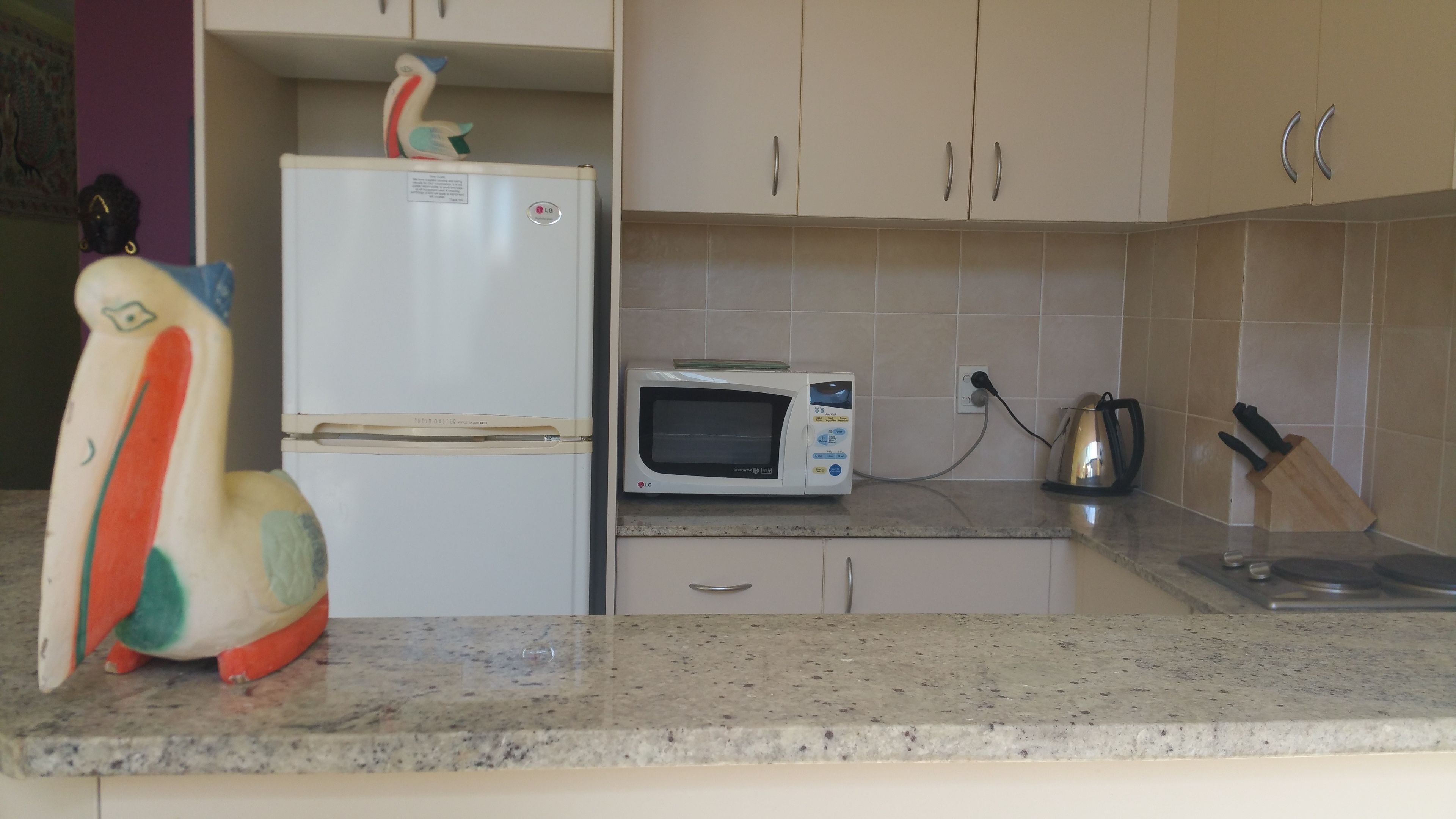 full-sized fridge, microwave, stovetop, dishwasher