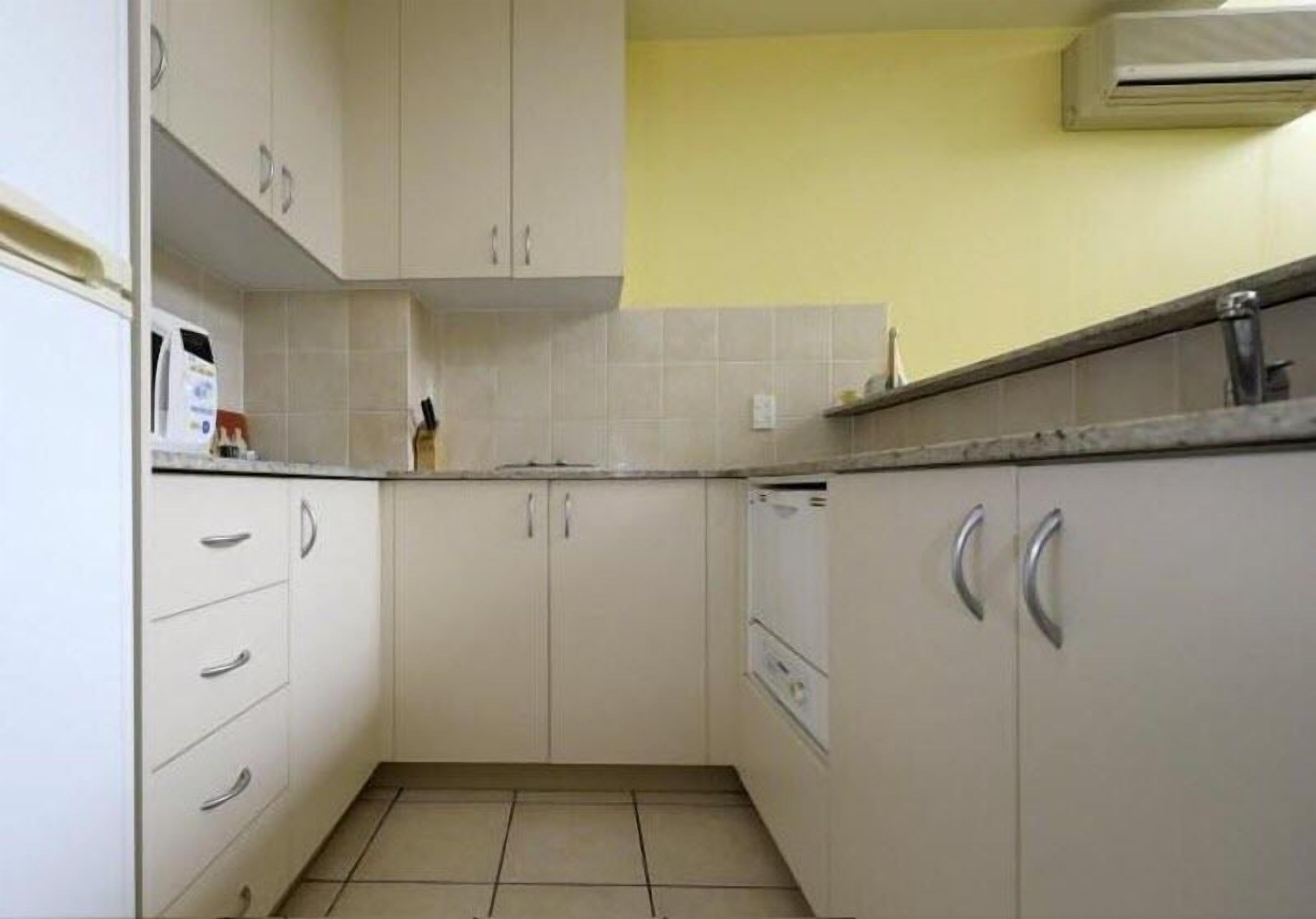 full-sized fridge, microwave, stovetop, dishwasher