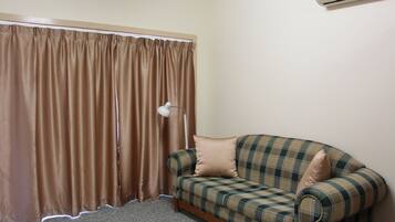 Executive Room, 1 Queen Bed, Kitchenette | Living room | LCD TV, DVD player