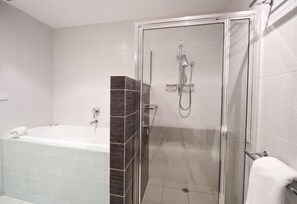 Shower, hair dryer, towels, toilet paper