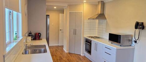 3 Bedroom House | Private kitchen | Fridge, microwave, coffee/tea maker, electric kettle