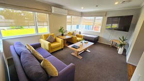 3 Bedroom House | Living area | TV - Carramar Motor Inn (Palmerston North)