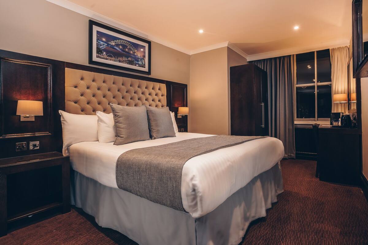 City Double Room | Minibar, desk, laptop workspace, blackout drapes