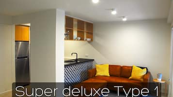1 Bedroom Super Deluxe Apartment | Living room | 55-inch LCD TV with digital channels, TV, Netflix
