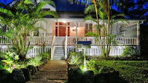 A house with a porch, steps, and a fence. - Arcadia House (Byron Bay)