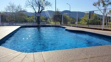 Relax by the pool surrounded by lush views of the surrounding landscape.